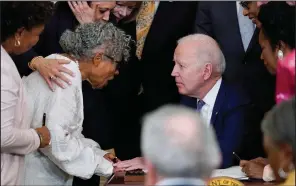  ?? (AP/Evan Vucci) ?? President Joe Biden speaks Thursday with Opal Lee of Texas, who campaigned for passage of the Juneteenth National Independen­ce Day Act, which Biden signed in the East Room of the White House.