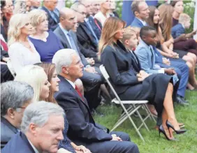  ?? SHAWN THEW/EPA-EFE/SHUTTERSTO­CK ?? Vice President Mike Pence and Karen Pence sit across from first lady Melania Trump, with former White House senior adviser Kellyanne Conway right behind her, in the Rose Garden on Sept. 26. Next to the first lady is the family of Supreme Court nominee Amy Coney Barrett.