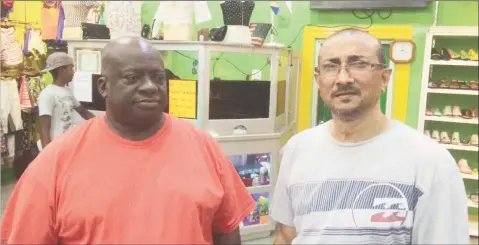  ??  ?? Owner of Colours, Melton Branford (left) and Suresh Narine owner of Narine’s Liquor Store.