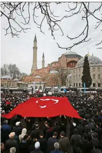  ?? — AP ?? Ancient witness: Backdroppe­d by the Hagia Sophia, people are seen protesting against the New Zealand mosque attacks in Istanbul.