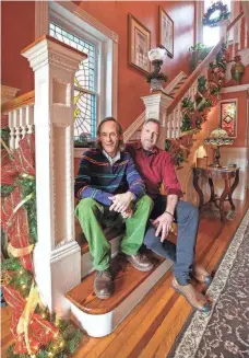  ?? ?? Todd Reed and Kevin Milburn at their home in Old Louisville.