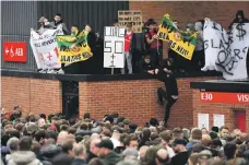  ?? AFP ?? United fans protesting against the club’s American owners caused the game against Liverpool on Sunday to be called off