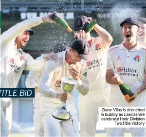  ??  ?? Dane Vilas is drenched in bubbly as Lancashire celebrate their Division Two title victory