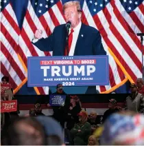  ?? AFP PHOTO ?? NEARING NOMINATION
Former US president and 2024 presidenti­al hopeful Donald Trump is seen on a screen while speaking during a ‘Get Out the Vote’ rally at the Greater Richmond Convention Center in Richmond, Virginia, on Saturday, March 2, 2024.