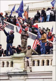  ?? Tribune News Service ?? Pro-Trump supporters storm the U.S. Capitol following a rally with President Donald Trump on Jan. 6, 2021, in Washington.