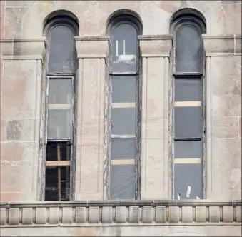  ??  ?? Boards support windows in Cohoes City Hall last week. Windows last about 30 years, but City Hall’s date back 126 years.