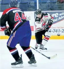  ?? SUPPLIED PHOTO ?? Niagara Falls Canucks forward Harrison Cottam, right, shown in action against the Welland Jr. Canadians in this file photo, led the junior B hockey team in goals during the 2016-17 season.