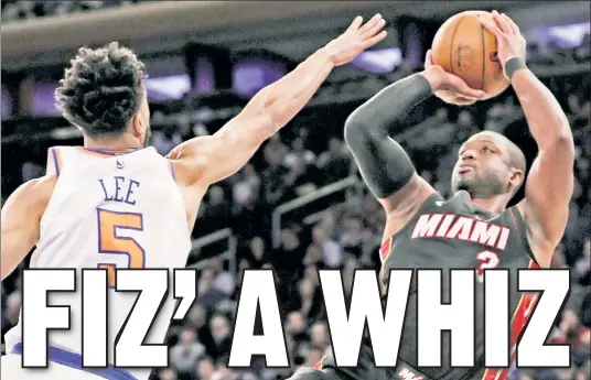  ?? AP (2) ?? HIGH PRAISE: Dwyane Wade, shooting a jumper during the Heat’s 122-98 loss to the Knicks on Friday, said the sky is the limit for what former Grizzlies coach and Heat assistant David Fizdale (below) could do for a franchise if hired. The Knicks could be in the market for a coach.