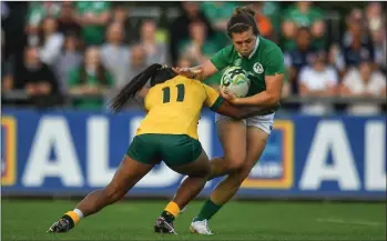  ??  ?? Katie Fitzhenry is tackled by Australia’s Mahalia Murphy in the 2017 World Cup clash in Belfield, Dublin.