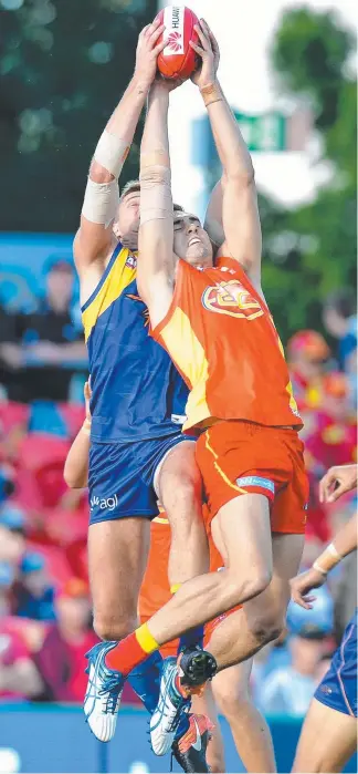  ??  ?? Suns defender Jack Leslie contests a mark against West Coast Eagles. Picture: GETTY IMAGES