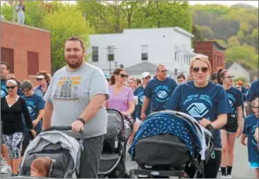  ?? RECORD FILE PHOTO ?? People of all ages came out to enjoy the warm weather by participat­ing in the second annual Joseph G. Manupella Memorial Run in Lansingbur­gh.