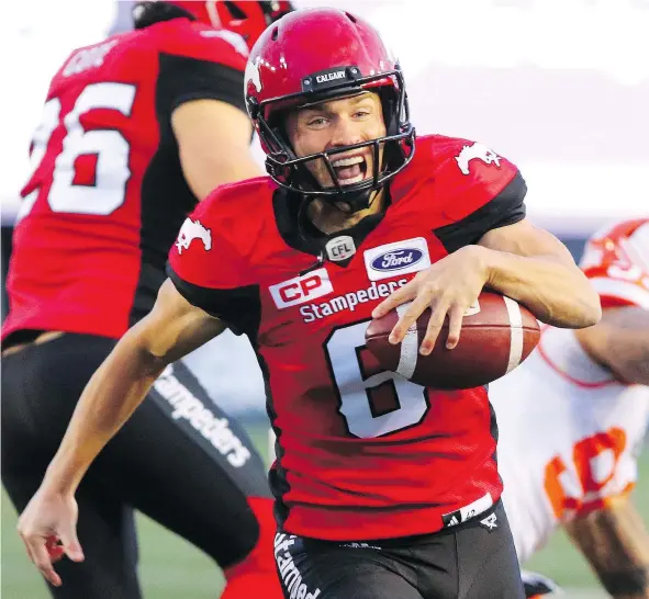  ?? — GAVIN YOUNG ?? Under pressure, Stampeders kicker Rob Maver decided to run the ball and picked up a first down against the B.C. Lions in the fourth quarter, scampering 24 yards to make one of the deciding plays of the game at McMahon Stadium on Saturday.