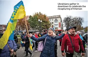  ?? ?? Ukrainians gather in downtown to celebrate the recapturin­g of Kherson