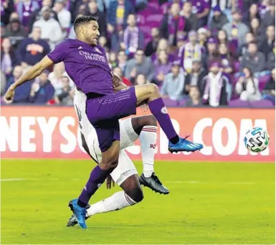  ?? JOE BURBANK/ORLANDO SENTINEL ?? Orlando City’s Tesho Akindele sets up for a shot on goal during the Feb. 29 game against Real Salt Lake at Exploria Stadium. MLS and players are reportedly close to a labor deal that would allow teams to resume play with a tournament in Orlando.