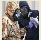  ??  ?? PROBE Forensic teams look for clues