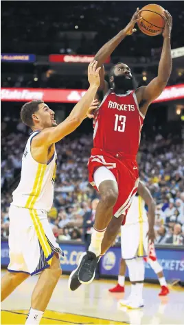  ?? EZRA SHAW/GETTY IMAGES ?? There could be some late movement among the top five in the conversati­on for NBA MVP, but No. 1 on that list appears to be clear sailing for James Harden of the Rockets — leaving the Warriors’ Klay Thompson grasping for air.