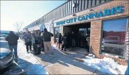  ?? GARY MIDDENDORF/DAILY SOUTHTOWN ?? Customers line up outside Windy City Cannabis in Homewood in January when recreation­al marijuana became legal in Illinois. Two shops are eyeing a Tinley Park location.