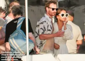  ??  ?? Fassbender stayed close to Vikander on the eve of their wedding weekend in Ibiza.