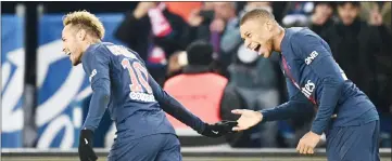 ??  ?? Paris Saint-Germain’s Kylian Mbappe (right) celebrates with Neymar after scoring against Lille (LOSC) at the Parc des Princes stadium in Paris. — AFP photo