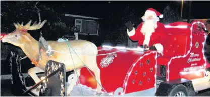  ??  ?? Santa on his sleigh as he made his way around Shepshed on a previous tour. CNF