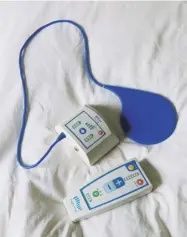  ??  ?? Below The remote control and charger for Lewisohn’s Nhs-supplied neurostimu­lator pain-relief device