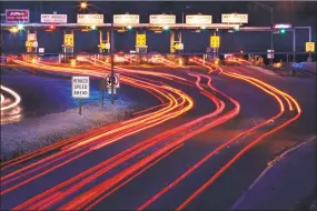  ?? Robert F. Bukaty / AP file photo ?? Traffic slows for the York tolls in York, Maine, on the Maine Turnpike.