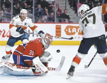  ?? PHOTOS MARTIN CHEVALIER ?? Le gardien du Canadien, Carey Price, s’est montré solide devant Frank Vatrano, des Panthers, en route vers son 47e jeu blanc.