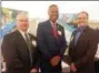  ?? EVAN BRANDT — DIGITAL FIRST MEDIA ?? Montgomery County Commission­ers’ Vice Chairman Ken Lawrence Jr., center, stopped by the Traffic Planning and Design booth to chat with Greg Richardson, left, executive vice president and Christophe­r Lincoln, right, project manager, during Thursday’s Pottstown Progress Luncheon at Sunnybrook.