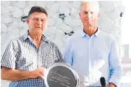  ?? ?? Racehorse breeder Graham Gimblett with pedigree expert Peter Lagan and the silver platter awarded for the 2023 NZB Standardbr­ed Trotting Broodmare of Excellence Award.