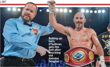  ?? AP ?? Belting up: Gary O’Sullivan gets the belt after knocking out Antoine Douglas