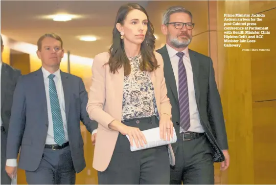  ?? Photo / Mark Mitchelll ?? Prime Minister Jacinda Ardern arrives for the post-Cabinet press conference at Parliament with Health Minister Chris Hipkins (left), and ACC Minister Iain LeesGallow­ay.