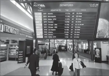  ?? NWA Democrat-Gazette/BEN GOFF ?? A screen displays departures­on March 3 at Northwest Arkansas Regional Airport in Highfill.