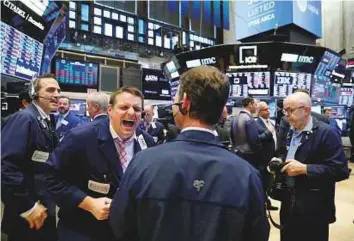  ?? Reuters ?? Traders at the New York Stock Exchange yesterday. Wall Street was set for a modestly firmer opening, potentiall­y building on the previous session’s gains.