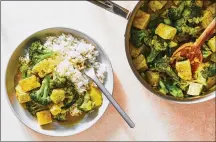  ?? STYLIST: MONICA PIERINI. JULIA GARTLAND/THE NEW YORK TIMES FOOD ?? A vegetable tofu curry. It’s a fast, one-pot vegetarian meal from Genevieve Ko, in which the tofu soaks up the flavorful curry sauce, and then gets tossed with the vegetables to serve over rice.