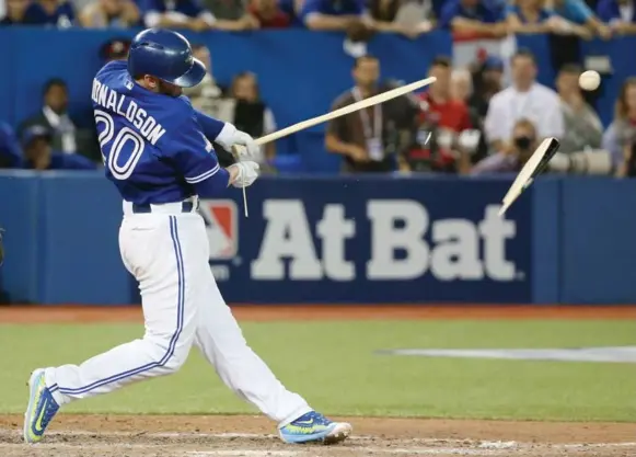  ?? STEVE RUSSELL/TORONTO STAR ?? Josh Donaldson breaks his bat on a day when the Jays’ bats struggled. After Donaldson’s first-inning homer, the Jays’ No. 2 to No. 5 hitters went 1-for-21 against Cole Hamels and five relievers.