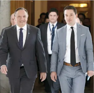  ?? JACQUES BOISSINO/THE CANADIAN PRESS ?? Quebec Premier François Legault and Minister of Immigratio­n, Diversity and Inclusiven­ess Simon Jolin-Barrette are calling for a rational debate on the religious symbols bill.