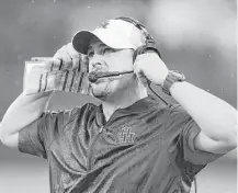  ??  ?? It was a long day for UH coach Tom Herman, who saw his team’s hopes for an undefeated season go up in smoke.