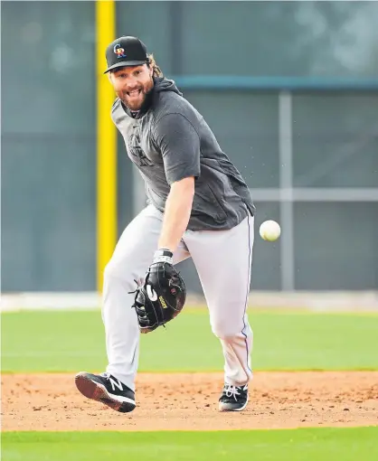  ?? RJ Sangosti, The Denver Post ?? First baseman Daniel Murphy takes ground balls during spring training for the Rockies at Salt River Field at Talking Stick last week in Scottsdale, Ariz.