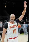  ?? THE ASSOCIATED PRESS FILE PHOTO ?? Vince Carter waves to the crowd as he leaves the court in Atlanta. Carter made his retirement official Thursday.