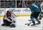  ?? NHAT V. MEYER — BAY AREA NEWS GROUP, FILE ?? Avalanche goaltender Pavel Francouz (39) blocks a shot in front of the Sharks’ Evander Kane (9) in the third period at SAP Center in San Jose on March 8.