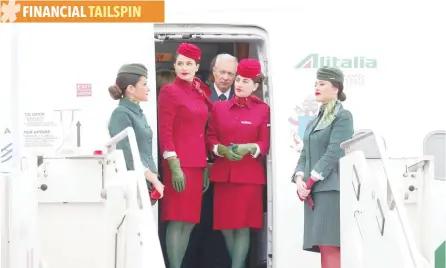  ?? — AFP ?? Alitalia’s flight attendants are seen at the Leonardo da Vinci-Fiumicino Airport in Rome.