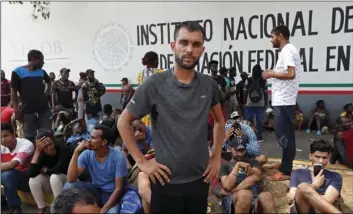  ??  ?? In this 2019 file photo, Rahjit, from India, poses for a photo as he waits with other migrants for a ticket to register their entry into Mexico at an immigratio­n station in Tapachula, Chiapas state, Mexico. AP PHOTO/MOISES CASTILLO