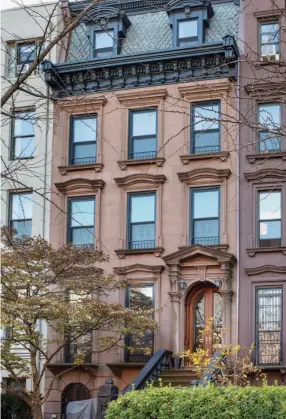  ??  ?? LEFT The Brooklyn row house rises five storeys, from English basement to mansard level. There’s also a cellar.