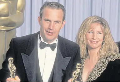  ??  ?? ▼ Barbra Streisand, left, and with Kevin Costner after Dances With Wolves’ 1991 Oscar win.