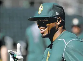  ?? CHRIS CARLSON/ASSOCIATED PRESS ?? Rajai Davis, 36, who played for Cleveland in the World Series, is glad to be back with the A’s.