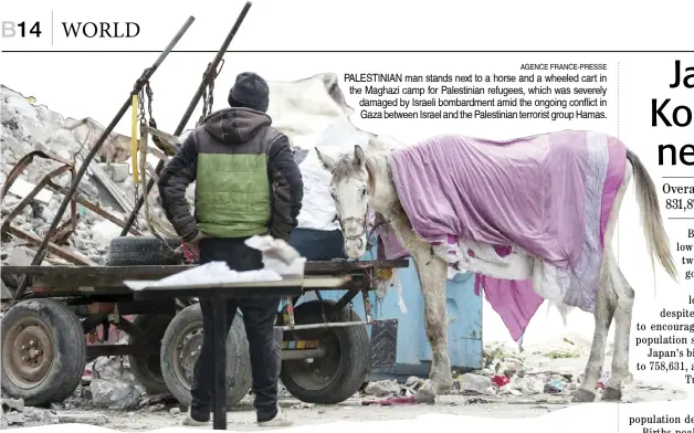  ?? AGENCE FRANCE-PRESSE ?? PALESTINIA­N man stands next to a horse and a wheeled cart in the Maghazi camp for Palestinia­n refugees, which was severely damaged by Israeli bombardmen­t amid the ongoing conflict in Gaza between Israel and the Palestinia­n terrorist group Hamas.