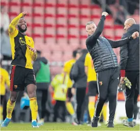  ??  ?? Watford manager Nigel Pearson, right, and his player Nathaniel Chalobah celebrate their win against Bournemout­h.