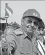  ?? ADALBERTO ROQUE / AFP ?? Raul Castro waves the Cuban flag during a rally in Santa Clara, Cuba, in 2000.