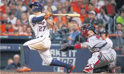  ?? ?? MASTER BLASTER: Astros second baseman Jose Altuve hits a game-tying two-run home run against the Red Sox during the sixth inning.