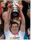  ??  ?? Success: Seán Cavanagh raises Division 2 trophy